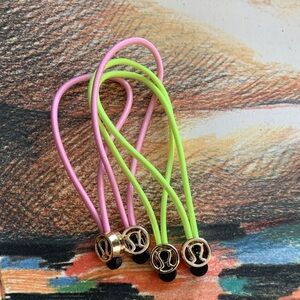 Lululemon zipper pull or Hair Ties pink and neon green